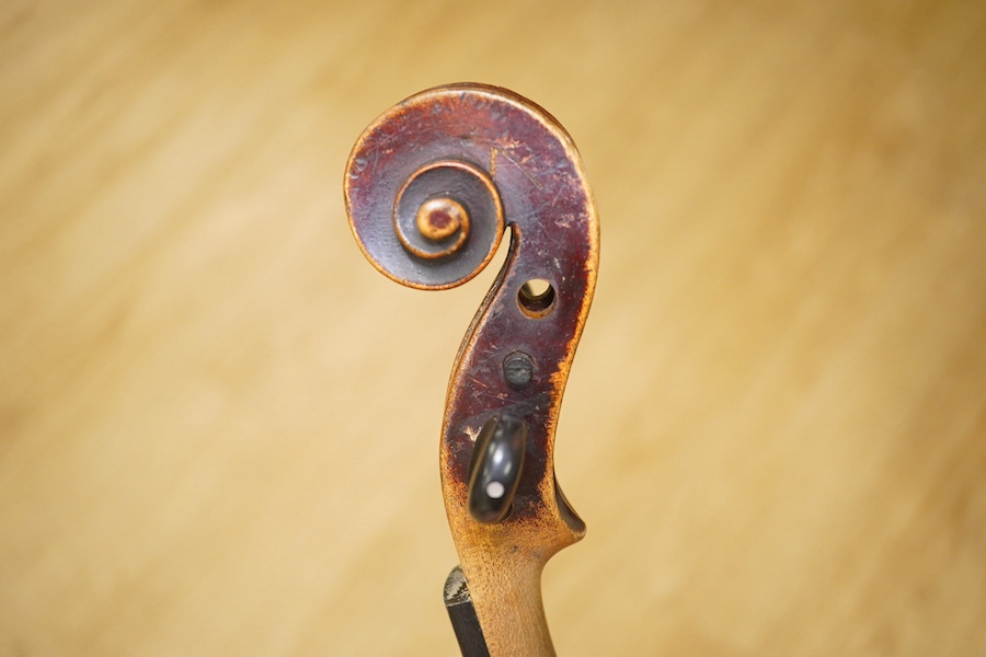 A late 19th century German violin, back measures 36cm. Condition - poor to fair